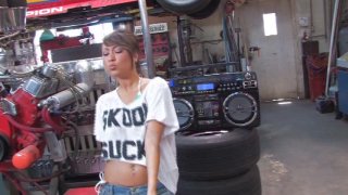 Asian Babe Jessie Jordan Rides a Mechanics Cock Image