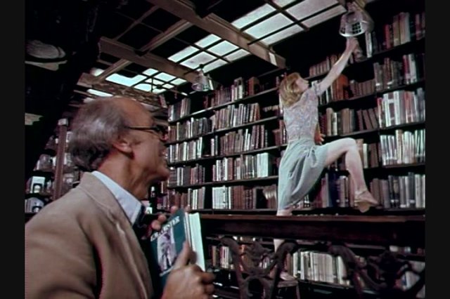 Blonde Babe Gets Caught Sucking Cock in the Library and Gets Spanked Image